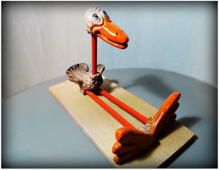 Pájaro de cerámica y metal