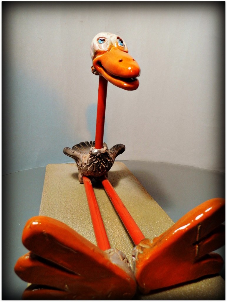 Pájaro de cerámica y metal