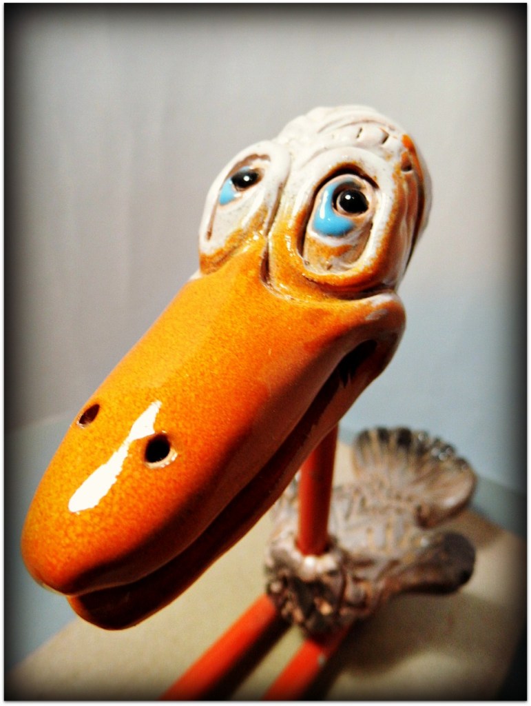 Pájaro de cerámica y metal