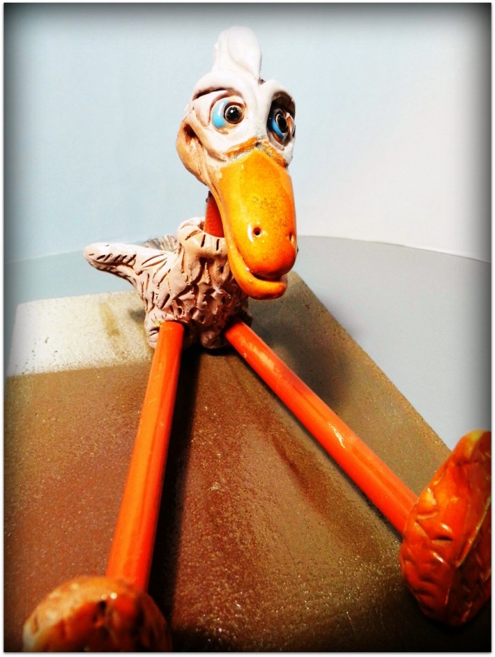 Pájaro de cerámica y metal