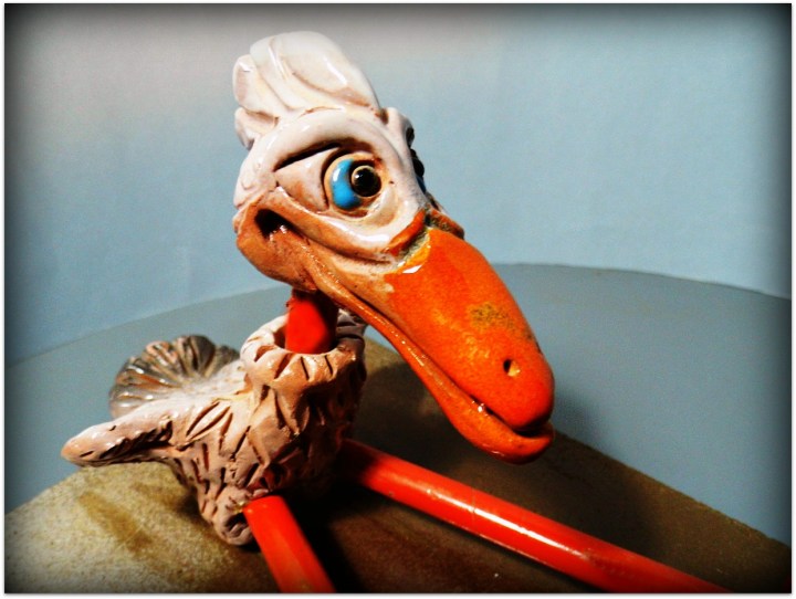 Pájaro de cerámica y metal