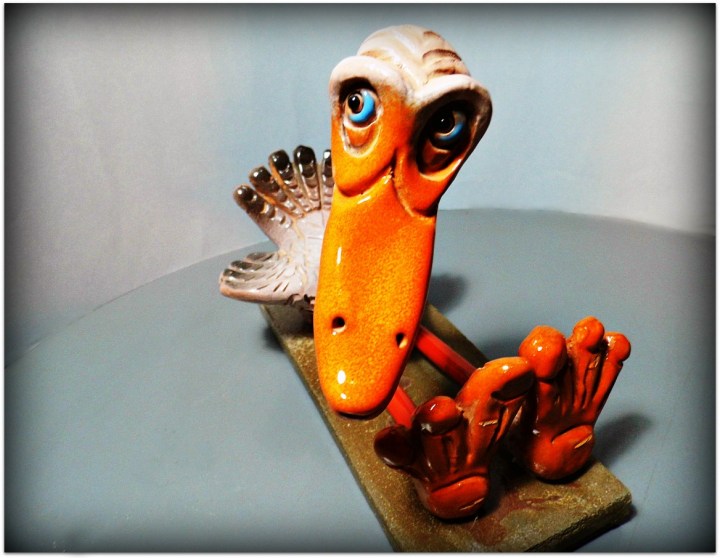 Pájaro de cerámica y metal