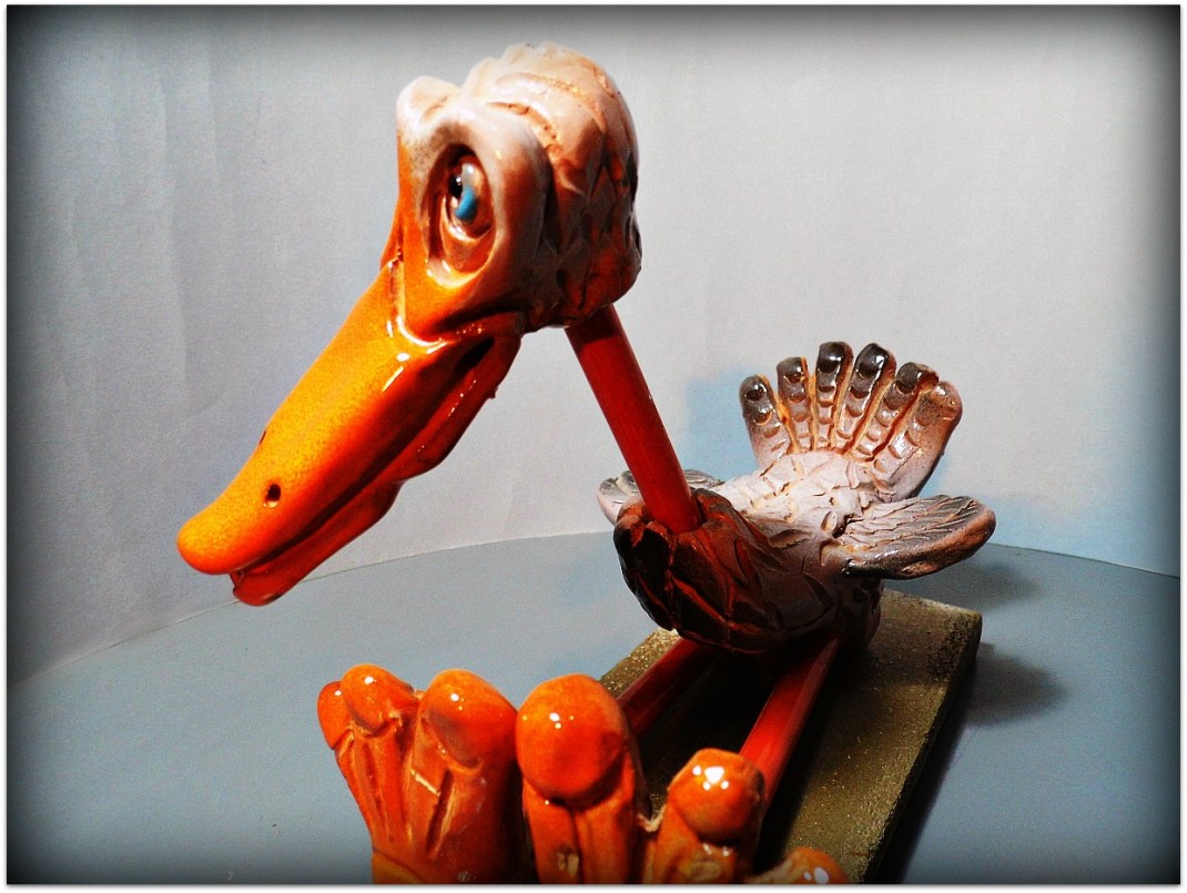 Pájaro de cerámica y metal