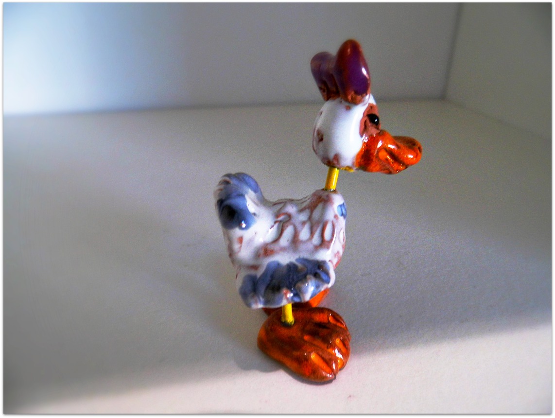 Patito de metal y cerámica