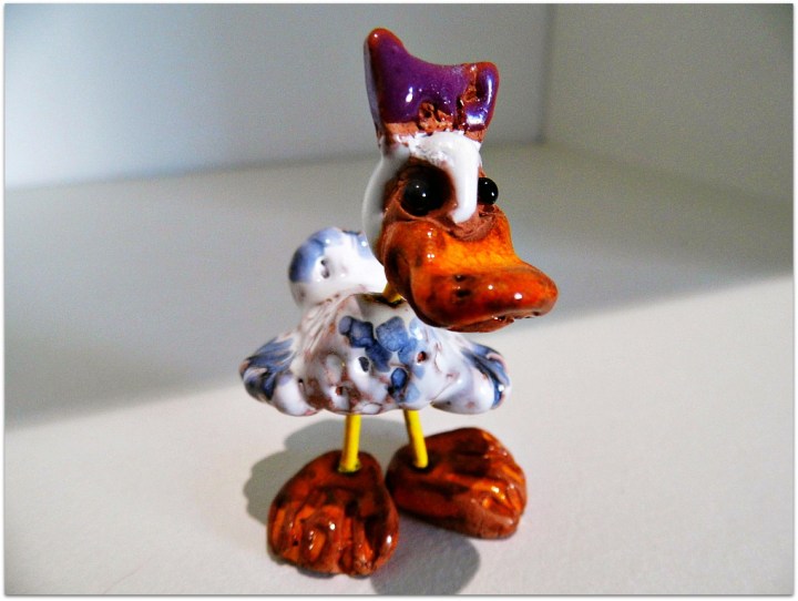 Patito de metal y cerámica