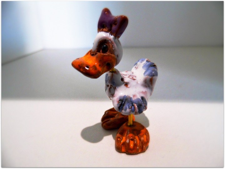 Patito de metal y cerámica